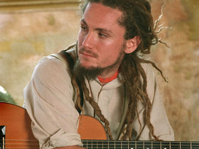 Modern acoustic guitar with John Butler